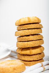 Danish cookies on a white background with coffee in a white cup, freshly brewed American coffee, isolate, breakfast, pastries, delicious shortbread cookies, catalog photo of food, coffee in bed