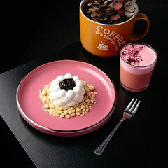 coffee in a cup and dessert on a plate