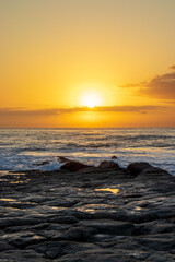 Sunrise over ocean at the South Coast of South Africa, located at Orange Rocks, Uvongo in Margate