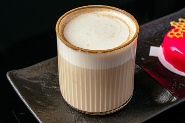 coffee in a cup and dessert on a plate