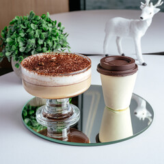 coffee in a cup and dessert on a plate