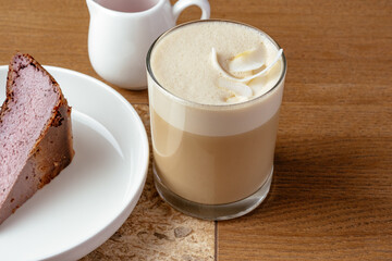 coffee in a cup and dessert on a plate