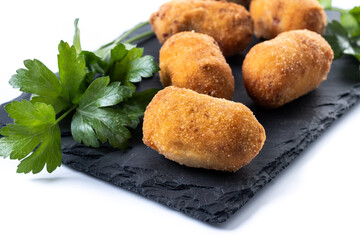 Fried cod croquettes isolated on white background. Traditional spanish food