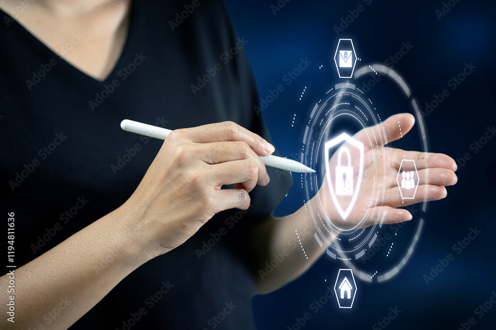 Poster a person using a digital pen to interact with a holographic shield and icons, showcasing advanced cy