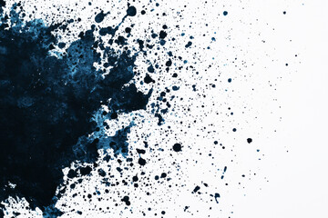Obraz premium Abstract blue ink splash on white background for artistic design.