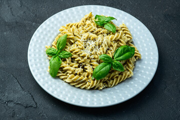 Pasta with basil sauce pesto . Italian food photography . Top view