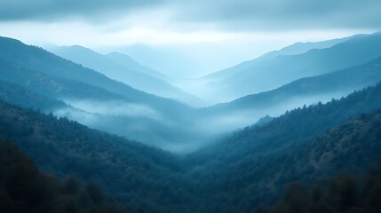 Obraz premium Misty blue mountain valley landscape.