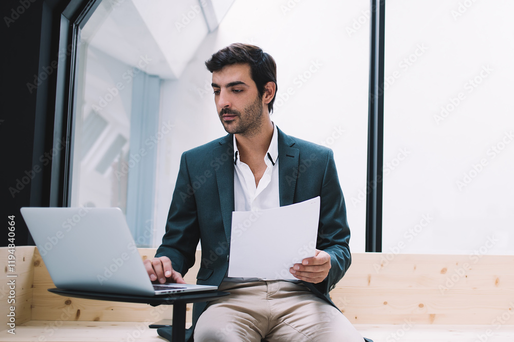 Aufkleber executive professional with paper documents making banking payment via application on modern laptop 