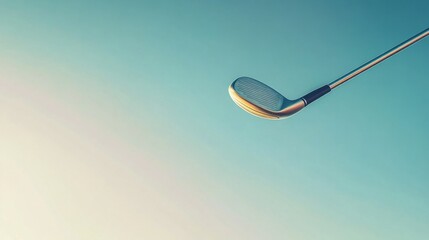A smooth arc of a golf club in motion against a backdrop of a clear blue sky.
