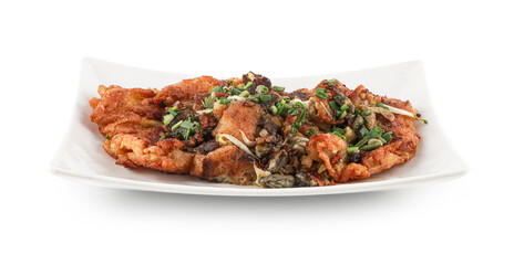 Oyster Omelette isolated on the white background with clipping path,  A popular Chinese Food in Thailand, fresh oyster mixed into an omelette and garnished with coriander leaves.