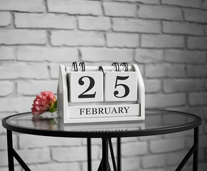 25 February from wooden blocks with letters, important date concept