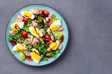 Canned Tuna salad with eggs and tomatoes photography . Top view