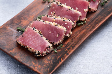 Sliced tuna steak with sesame photography . Top view