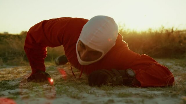 Suffocating Astronaut Crawls Lying On The Ground In Planet With Toxic Atmosphere