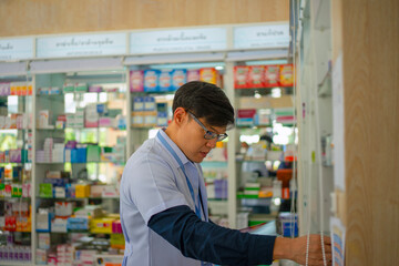 Fototapeta premium Pharmacist works at pharma store.