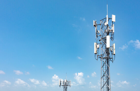Aerial view of mobile phone towers against a blue sky in the background.