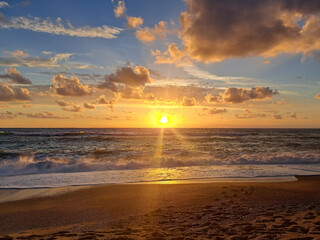 Fototapeta premium Seascape, Sunset over the sea. Sandy beach on the coast of Calabria, Italy