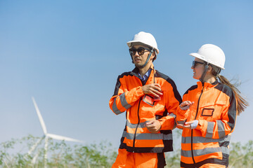Engineer workers teamwork working together service maintenance wind turbine clean power green energy