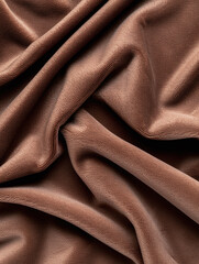 Obraz premium Close-up vertical background featuring soft chocolate brown velvet with visible folds and a rich, smooth texture.