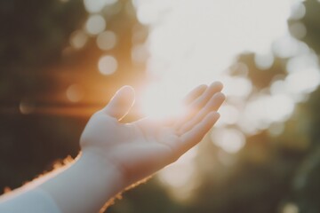 Silhouette of prayer human hand open palm up worship in the morning with sunrise sky. Freedom and spirituality concept. God helping repent catholic easter lent mind pray. Christian religion, belief