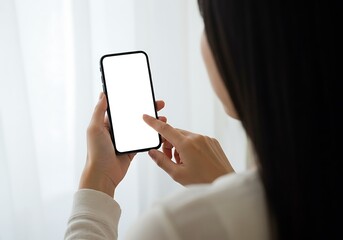 Woman hand holding using touch mobile phone white screen mockup Back view
