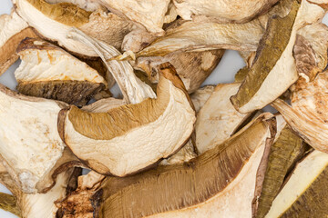 Heap of dried boletus slices on a dish close-up