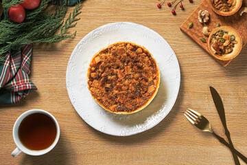 Apple crumb pie top view on a wooden table background. Apple crumble pie dessert, sweet and crunch