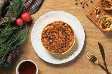 Apple crumb pie top view on a wooden table background. Apple crumble pie dessert, sweet and crunch