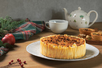 Apple crumb pie on a wooden table background. Apple crumble pie dessert, sweet and crunch with christmas ambient