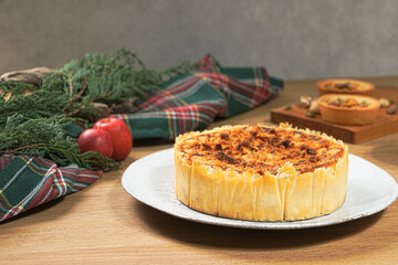 Apple crumb pie on a wooden table background. Apple crumble pie dessert, sweet and crunch with christmas ambient