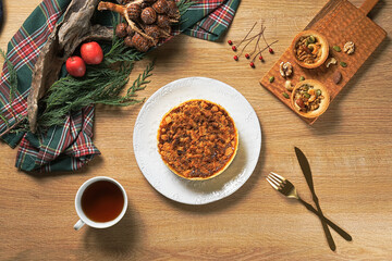 Apple crumb pie top view on a wooden table background. Apple crumble pie dessert, sweet and crunch
