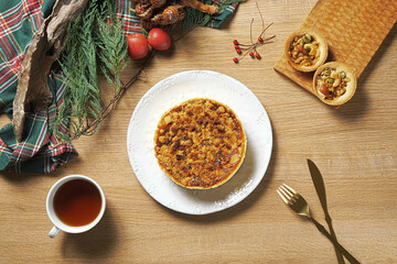Apple crumb pie top view on a wooden table background. Apple crumble pie dessert, sweet and crunch