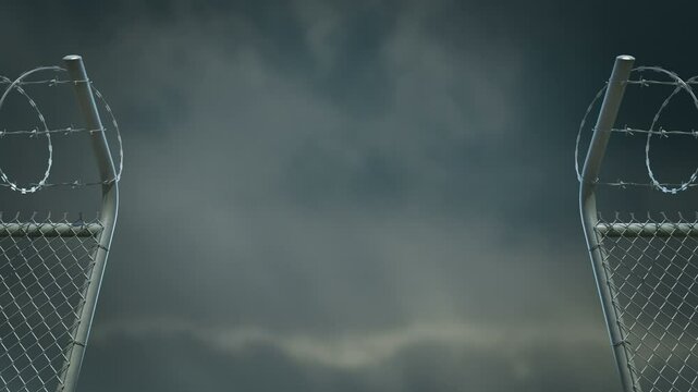 Barbed wire fence gate opens. Cloudy sky in the background. Includes alpha channel.
