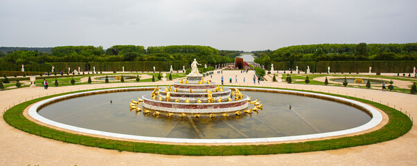 Versailles castle fountain panorama with the famous garden in the background.