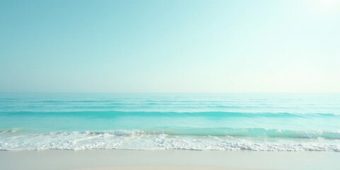 Obraz premium Serene Coastal Scene Gentle Waves Lap a Pristine Shoreline Under a Calm, Azure Sky