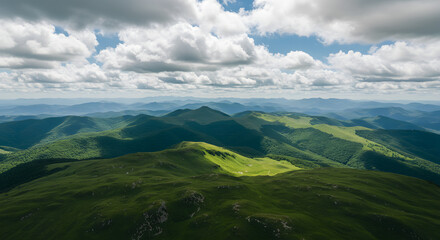 Fototapeta premium Green mountains under white clouds during daytime