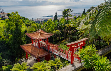 Monte Palace tropical garden with red pagoda, lakes and traditional buildings above the city of...
