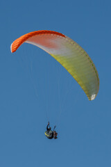 paraglider pilot flying with canopy
