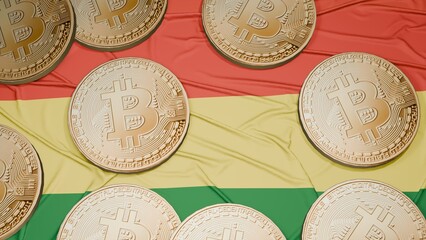 Several bitcoins are laid out on the flag of Bolivia