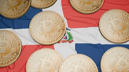 Several bitcoins are laid out on the flag of Dominican Republic