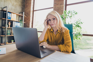 Photo of tired uncertain lady ceo dressed shirt working modern gadget indoors workplace workstation...