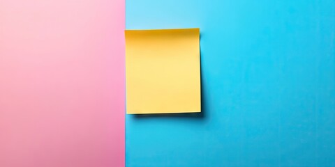 Fototapeta premium Yellow sticky note on vibrant blue background with pink corner creating ample copy space for messages and reminders.