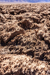 A rocky desert landscape with a few small rocks scattered around