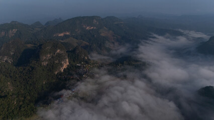 Clouds on high mountain peaks in the rainy season in the Asian rainforest..