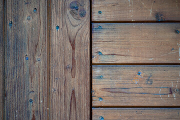 Close-up view of horizontal and vertical wood panel masonry