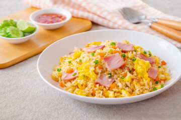 Fried rice with ham pork on white plate