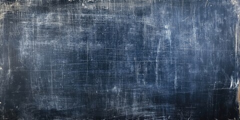 Erased chalkboard surface displaying textured dark blue and gray hues with subtle streaks and smudges extending across a horizontal layout.