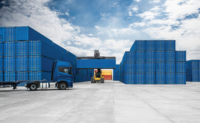 A blue container truck is pulling a yellow crane