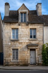 Charming rustic stone facade of a vintage french townhouse, architectural detail, old world charm