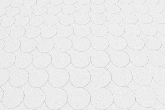 light grey background with fish-scale pattern